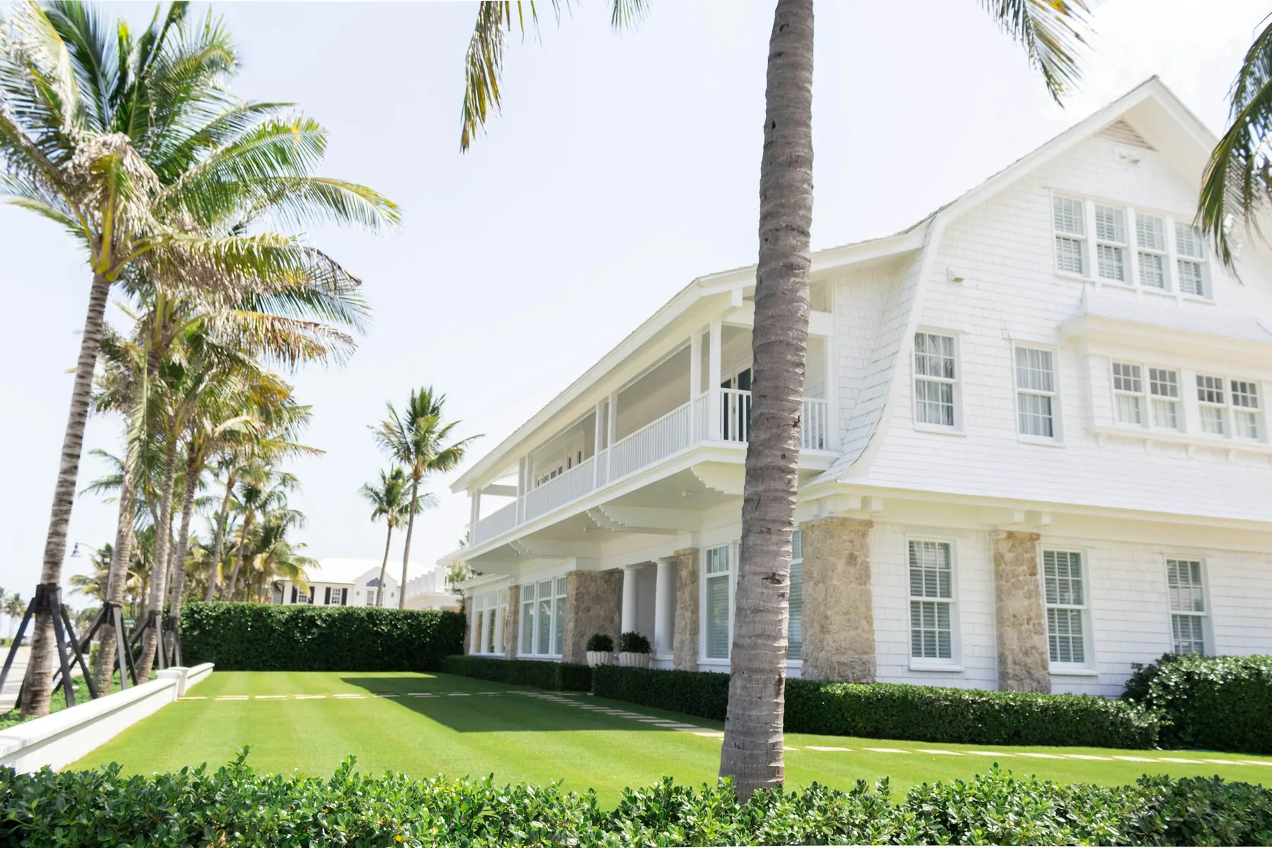 White house surrounded by palm trees